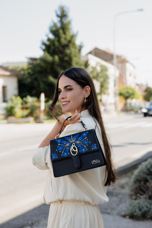 Hand-painted handbag with a blue and gold folk motif